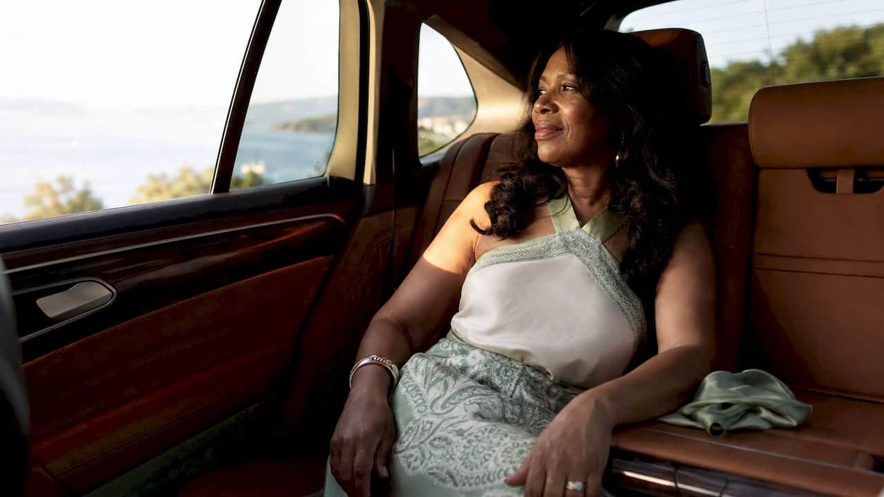 Luxury sedan interior with relaxed passenger