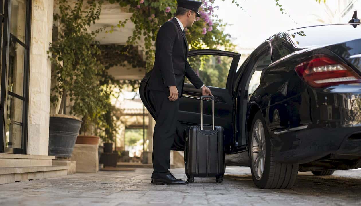 Chauffeur opening premium vehicle door
