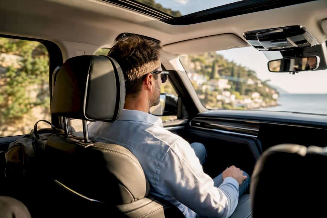 Luxury car interior with leather seats and window light