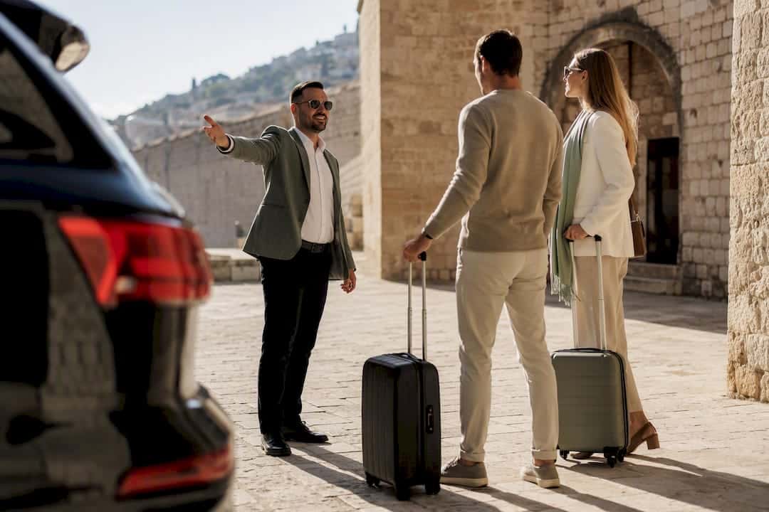 Driver-guide greeting travelers at Croatian heritage site